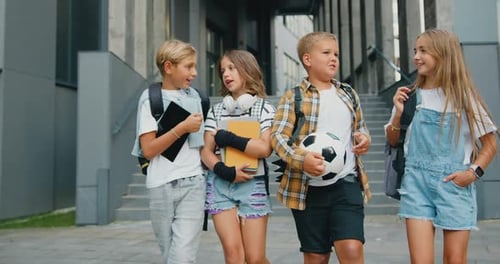 Happy Students Talking Outside School Building
