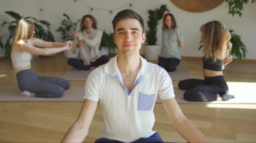 Yoga Class with Young Adults Practicing Wellness