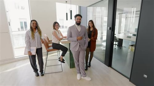 A Diverse Team Collaborates in a Modern Office Highlighting Their Achievements and Creativity