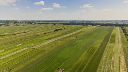 Wide Aerial View of Striped Farmland