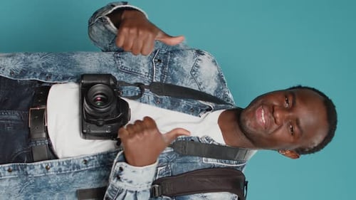 Vertical Video Male Model Photographer Doing Thumbs Up Gesture on Camera