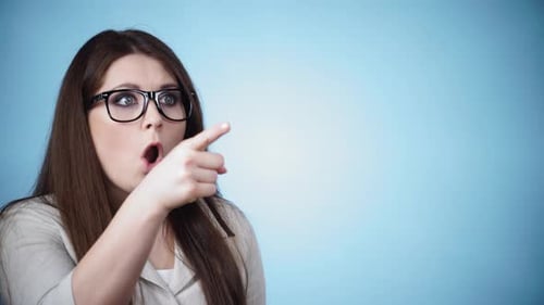 Surprised Woman Pointing with Hand Gestures