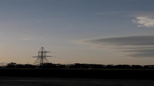 Utility Pole Silhouetted Against Colorful Dusk Sky