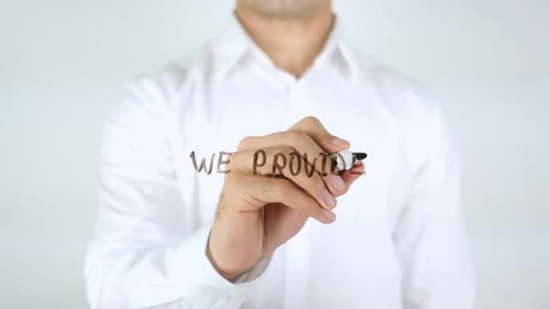 Man Writes 'We Provide' On Clear Surface