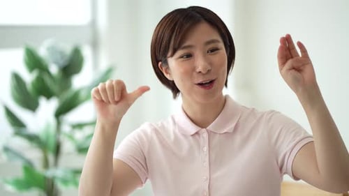 Smiling Woman Clapping and Cheering Indoors