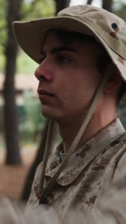 Soldier Stands At Attention Saluting The General In The Woods With Trees