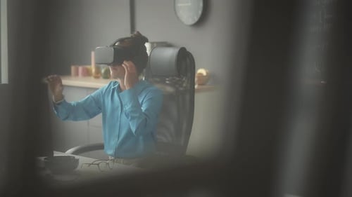 Female Developer Using VR Headset in Office