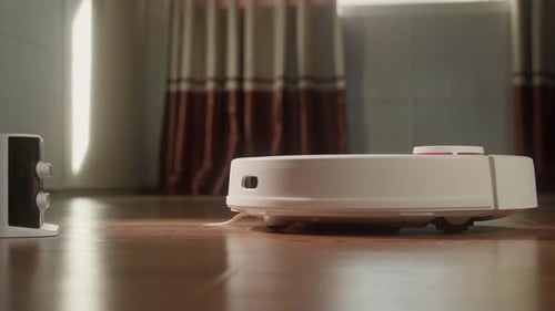 Robot Vacuum Moving Around Inside Room