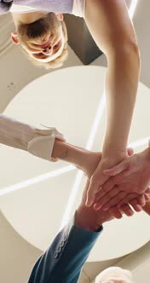 Low angle, hands stack and business people in office, investor and support for profit increase