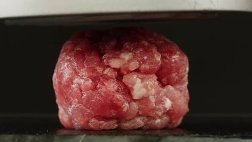 Cooking American Fat Smash Burger on Grill Closeup Beef or Pork Cutlet Smashing By Burger Press The