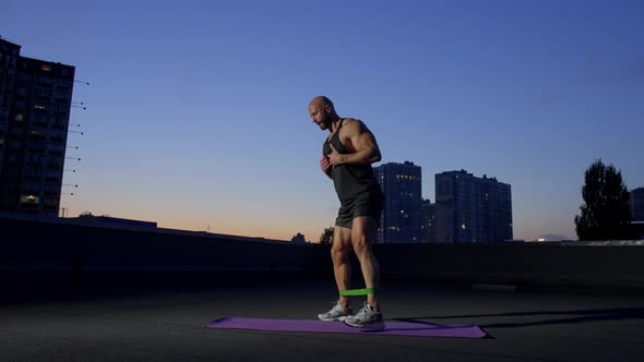 Straining Muscles of Body the Athlete Performs an Exercise with a ...