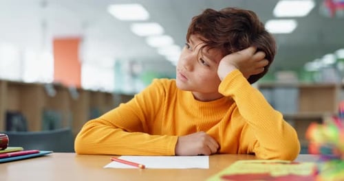 School, child and tired with thinking in library for learning study, education and academic fatigue