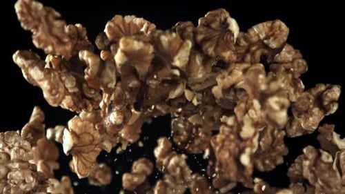 Shelled Walnuts Floating Upwards in Slow Motion