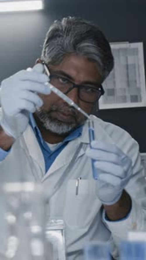 Scientist Conducting Experiment in Bright Laboratory