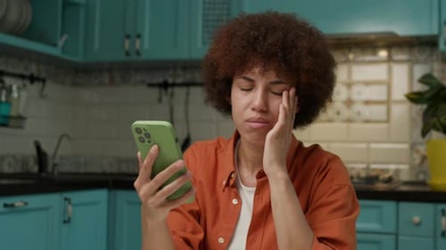 Woman Reacts to Bad News on Smartphone