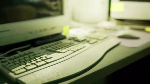 Old Computer Setup with Keyboard and Mouse on a Work Desk