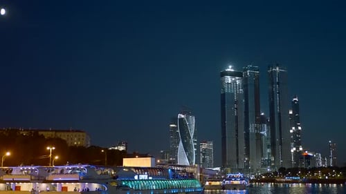 Night landscape with a view of the skyscrapers standing next to the river