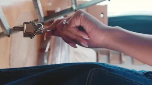 Hand holding house keys after purchase