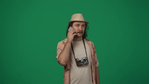 Man Talking on Phone Celebrating Against Green Screen