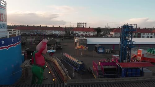 Amusement park seen from an aerial view, the camera travels from left to right showing the place