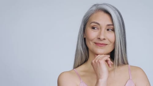 Middle Aged Happy Mature Asian Woman, Senior 50 Year Lady Flirty Looking Away, Smiling At Camera,...