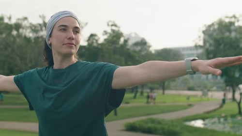 Woman Doing Asana during Yoga Practice in Park