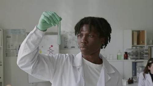 Scientist Holding Test Tube in Laboratory