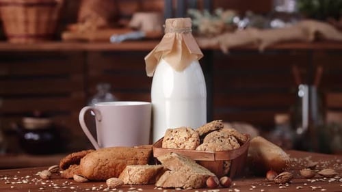 Fresh Milk and Whole Grain Flaxseed Bread on Wooden Table in Village House Food Rotating Slowly