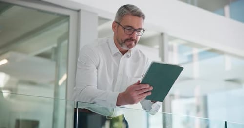 Businessman, tablet and reading in office with finance report, budget review and statement