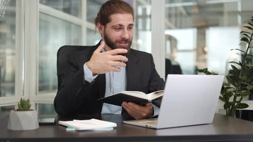 Manager Explaining Business Plan to Interlocutor During Video Call on Laptop