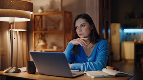 Stressed Woman Working Late at Her Desk