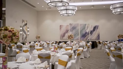 The dining area at a traditional wedding, adorned with a magnificent theme, is captured in an incred