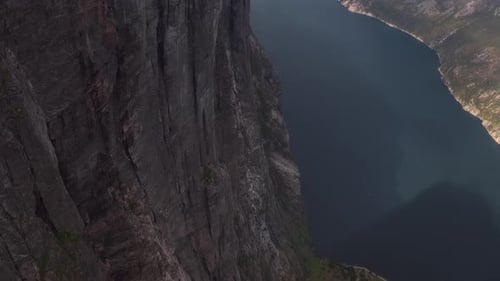 Aerial view of Norwegian fjord, showcasing rugged cliffs and peaceful waters