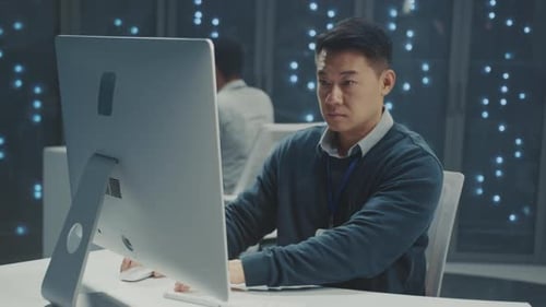 Man Working at Computer in Tech Office