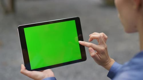 Hand Touching Mockup Tablet with Green Screen Closeup Manager Working Remotely