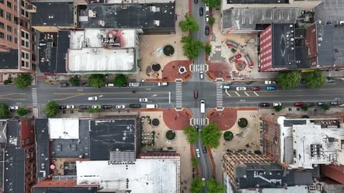 Traffic on junction in American downtown of city in USA. Rush hour time in small town.Aerial top dow