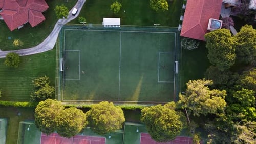 Aerial view of football soccer fields in green field 4K