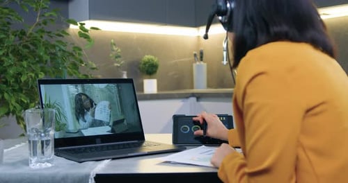 Adult Working Remotely in a Virtual Meeting