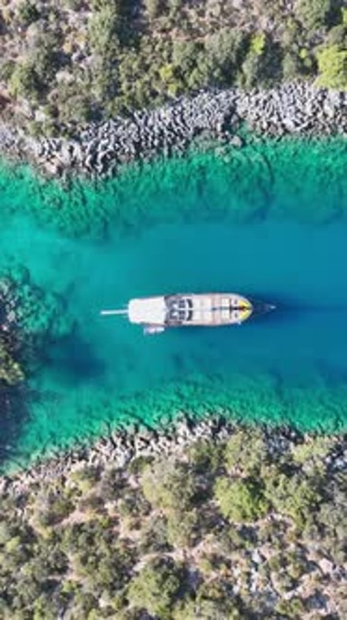 Vertical aerial view of gulet ship at sea