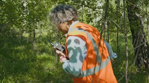 Rescue Ream Going through Woods while Searching for Lost Tourist