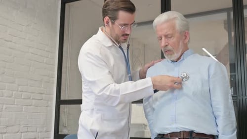 Doctor Examining Senior Patient with Stethoscope