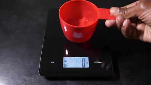 Measuring Cup on Digital Kitchen Scale