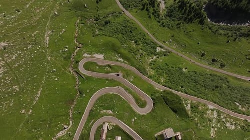 Conquering the Narrow Switchbacks of a Breathtaking Mountain Alpine Pass