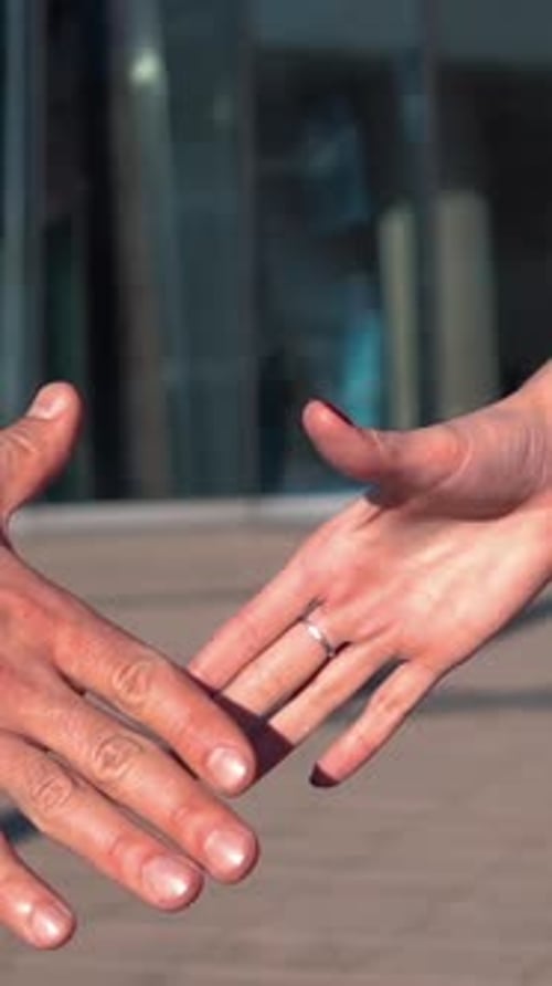 Business Handshake Between Two Partners in City