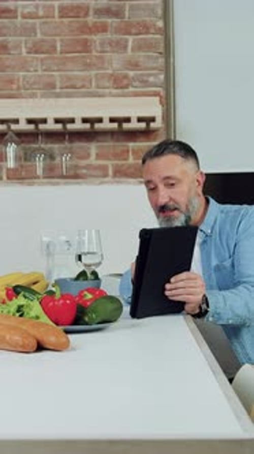 Couple Video Calling in Modern Kitchen with Food