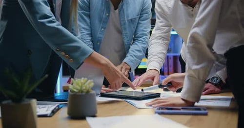 Team Members Discussing Technology and Solutions