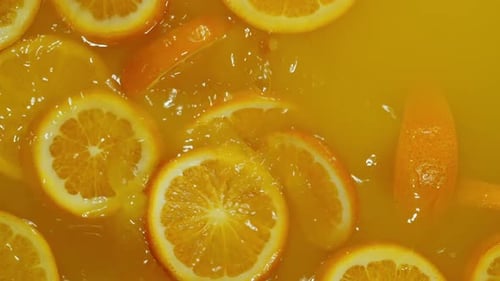 Splashes of Citrus Fruits in Carbonated Water Creating a Fizzy and Delicious Drink