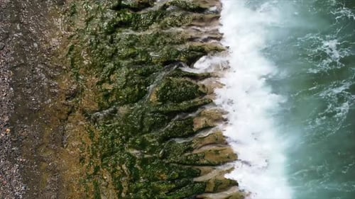 Sea Waves Crashing Against Beach Cliffs