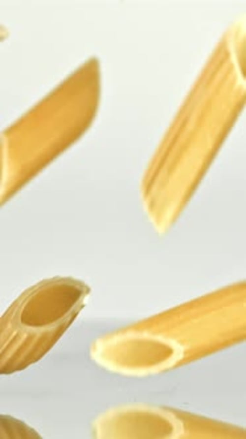 Super Slow Motion Dry Penne Pasta Filmed on a Highspeed Camera at 1000 Fps