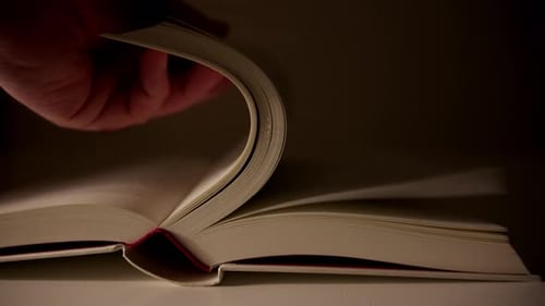 Turning book page forming curved shape